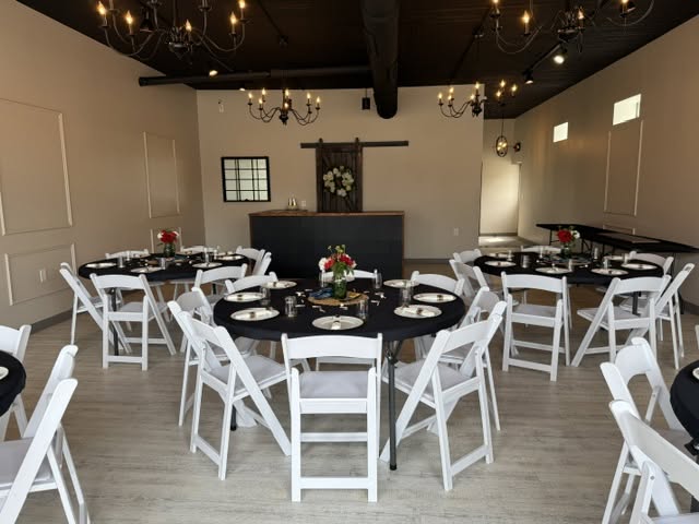 Venue set with black linens and flowers