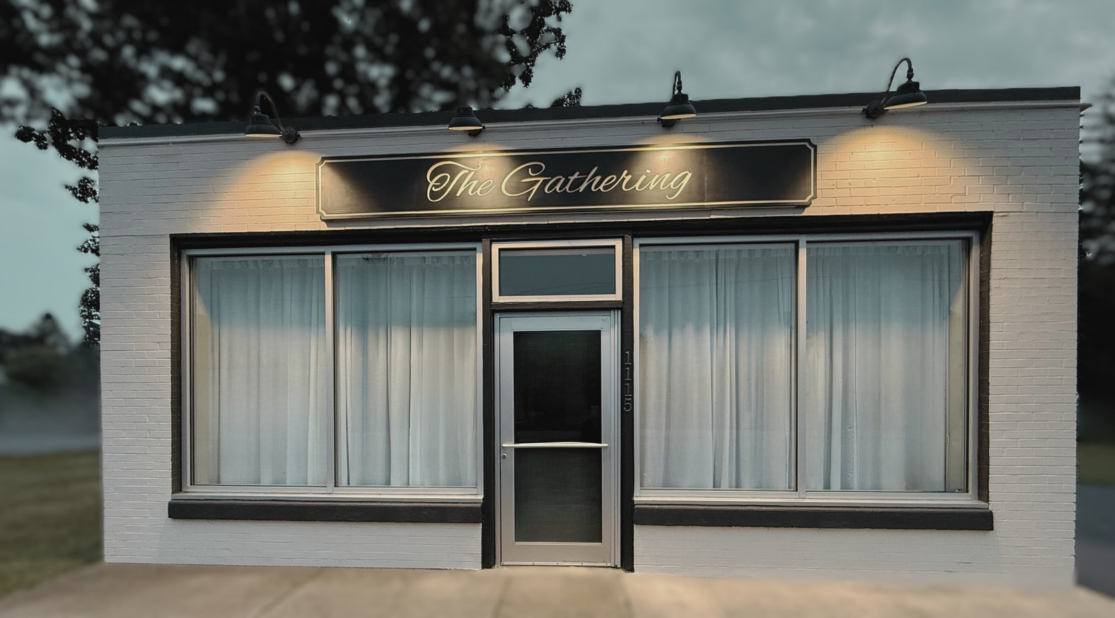 Exterior of The Gathering Olean with its illuminated venue sign